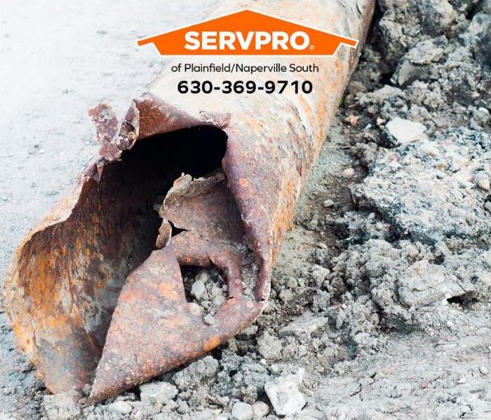 A damaged and corroded pipe is shown.